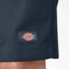 Pantalones cortos de trabajo de corte holgado y frente liso, 33 cm